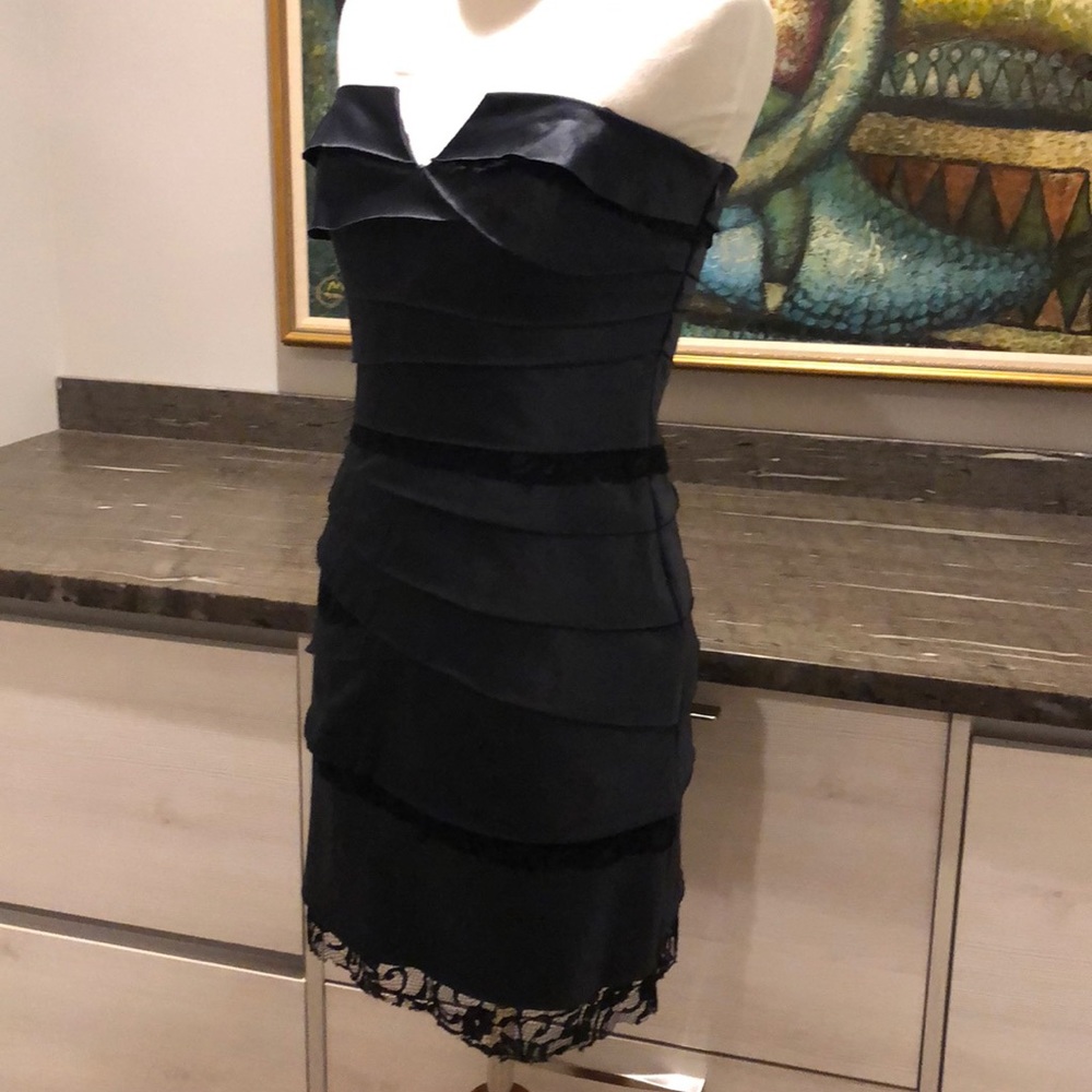 Strapless black cocktail dress.